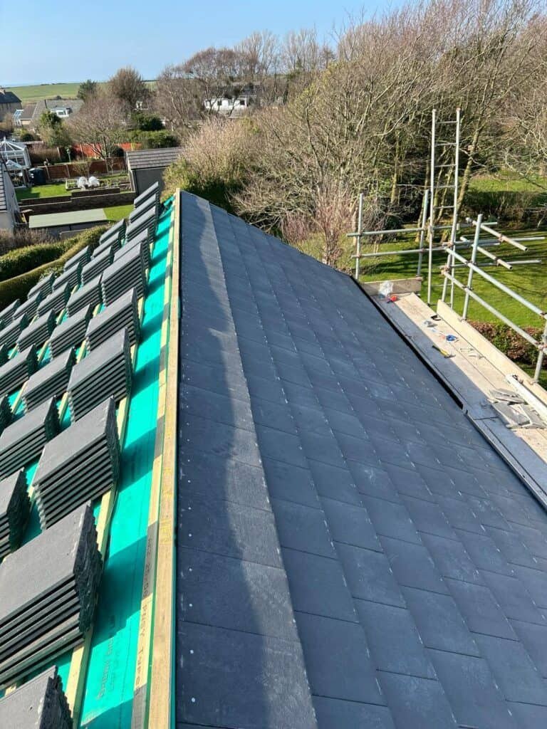 Slate roof installation on extension